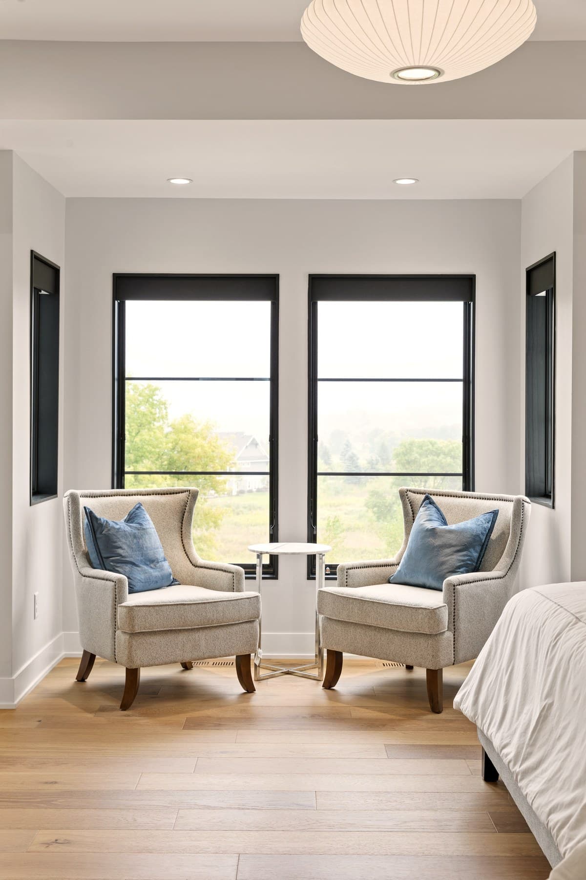 Elegant master bedroom with Lutron Sivoia QS Triathlon motorized shades