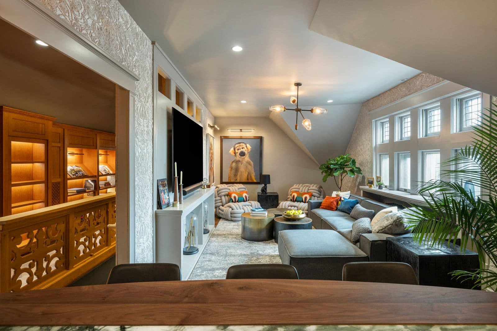 Modern kitchen with motorized shades providing optimal energy efficiency