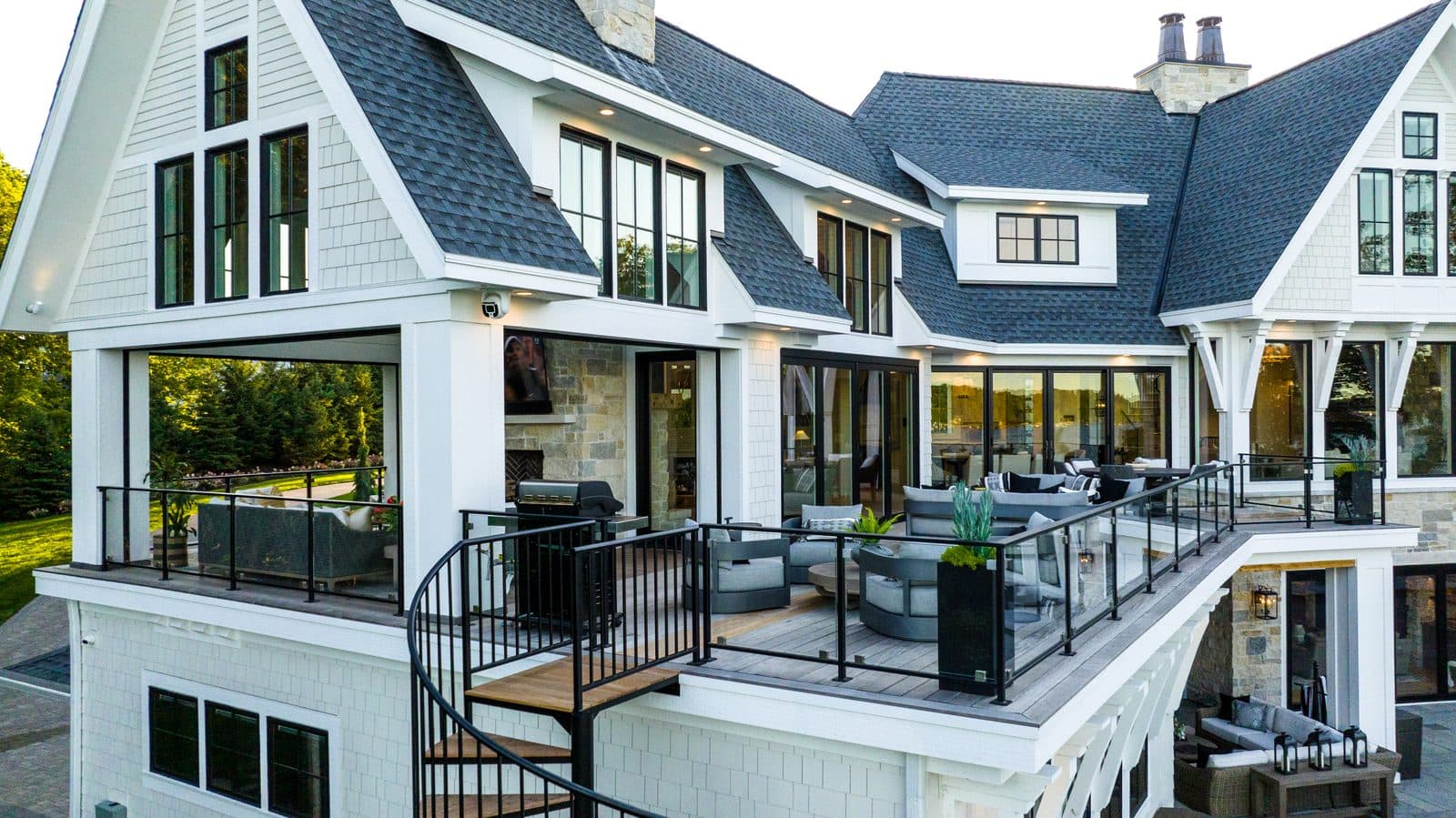 Multi-level deck with outdoor TV, distributed audio, and landscape lighting