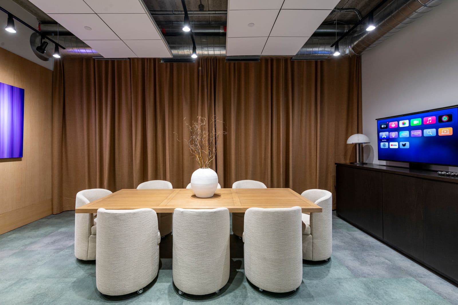 NorthStar design studio meeting room with dining table and display wall