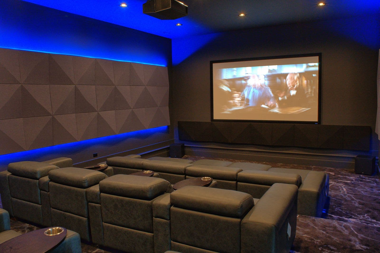 Multi-purpose media room with hidden technology and flexible lighting
